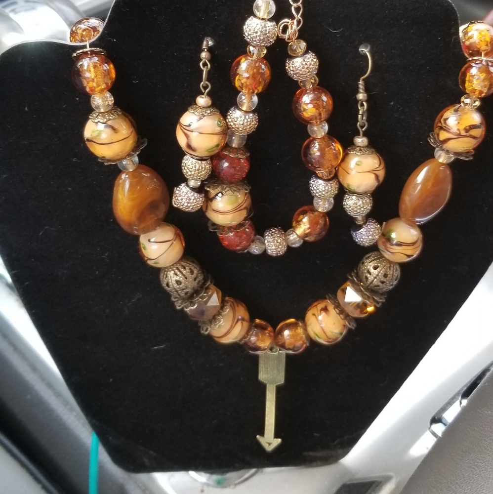 Handmade necklace,  earrings and bracelet in brown